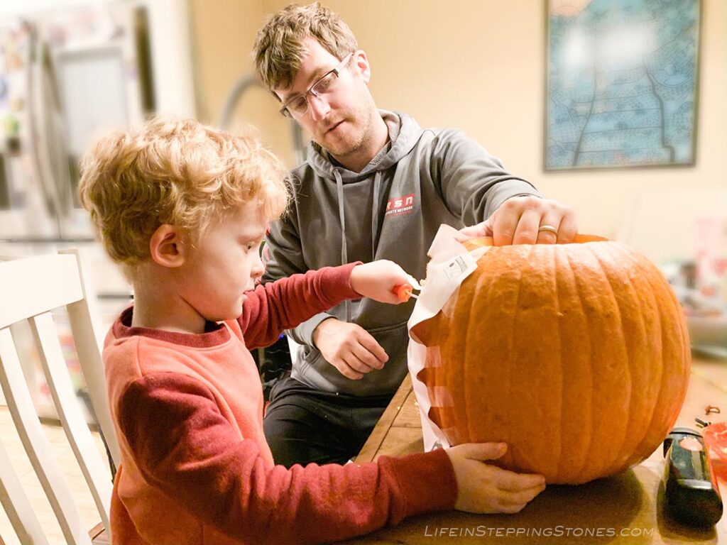 Carving a pumpkin with your child for Halloween