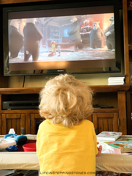 My preschooler watching Zootopia on a homeschooling day about discrimination and racism.