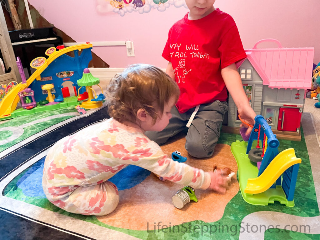 Play rug in nursery fits Little People toys with wide road and plenty of play space