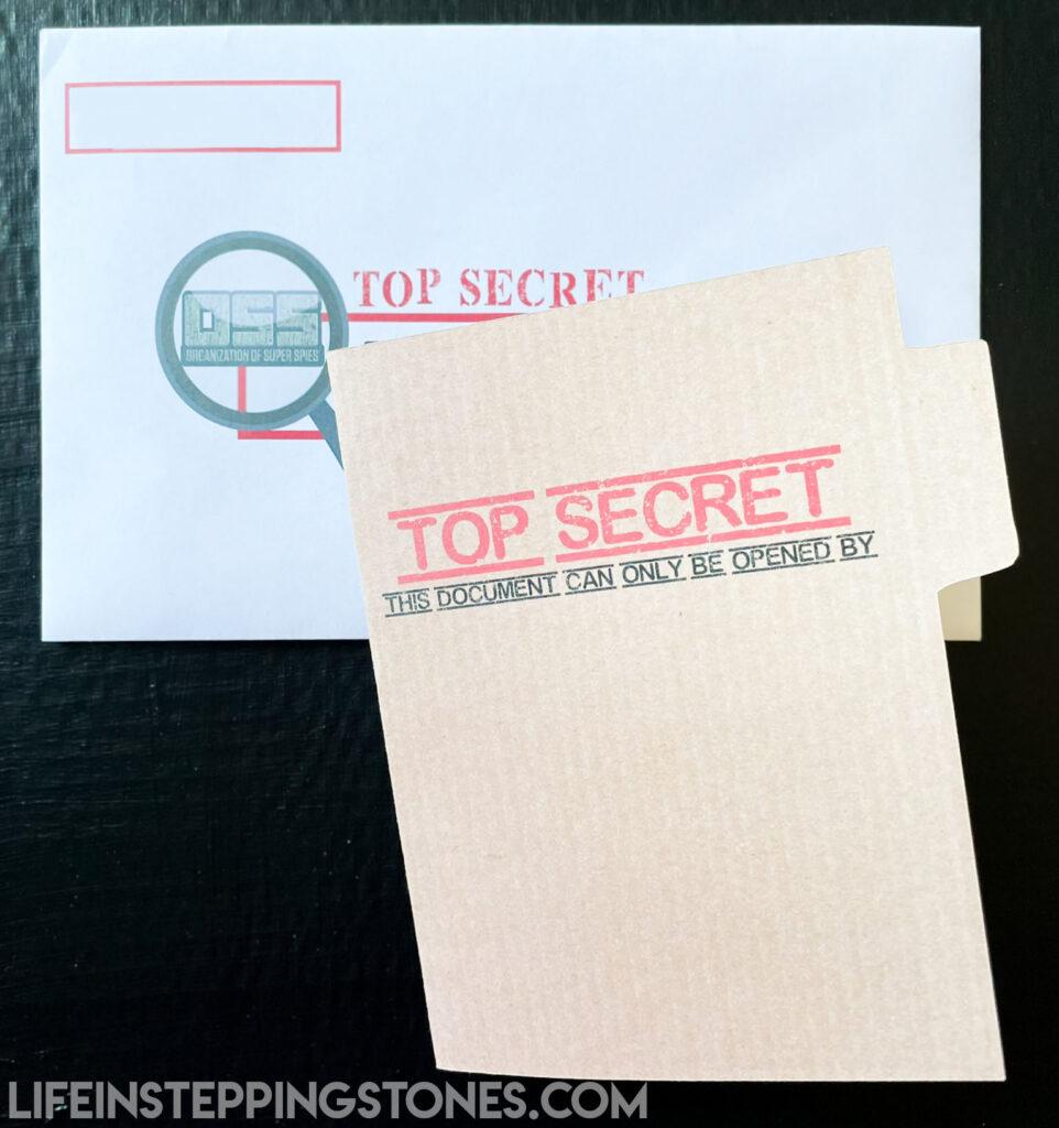 Secret Agent Spy Theme Birthday Party invitation with top secret manila folder and envelope