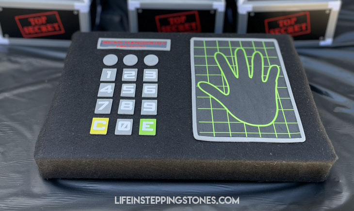 As kids arrive at the spy theme birthday party, they can scan their hands on this secret agent hand scanner!
