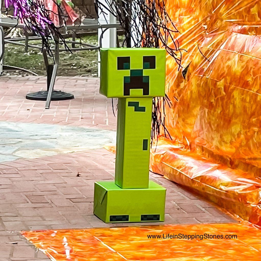 Minecraft Party Decoration ideas include creating The Creeper as a target for the archery, Bow and Arrow, activity.