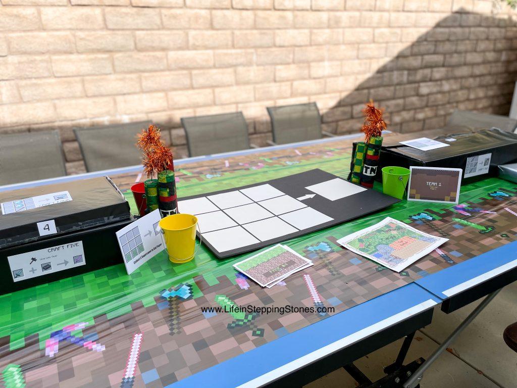 Minecraft Birthday party table setting with TNT table toppers and the Minecraft Crafting Board.