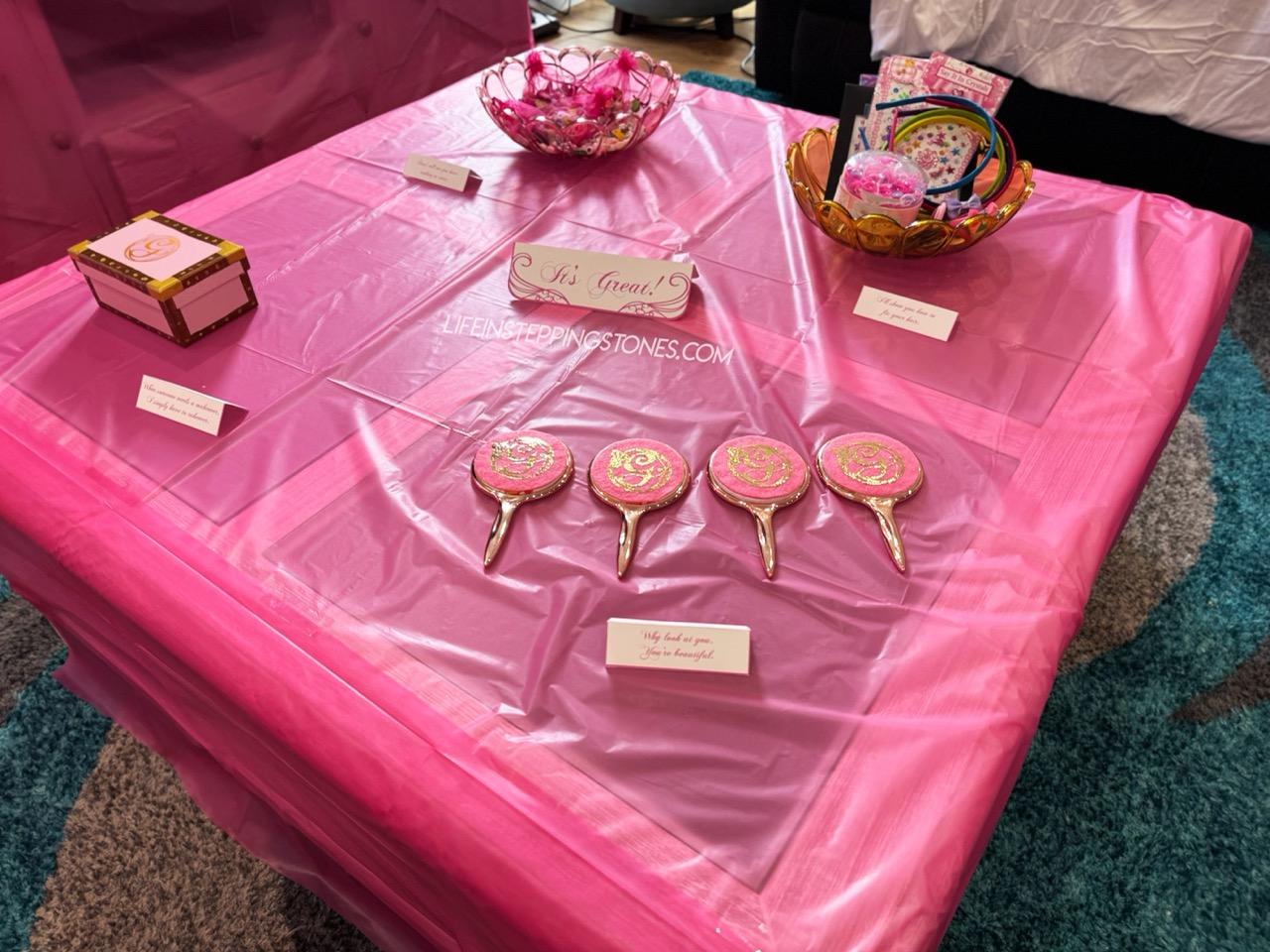 Craft table set up at Wicked themed birthday party with Glinda mirrors