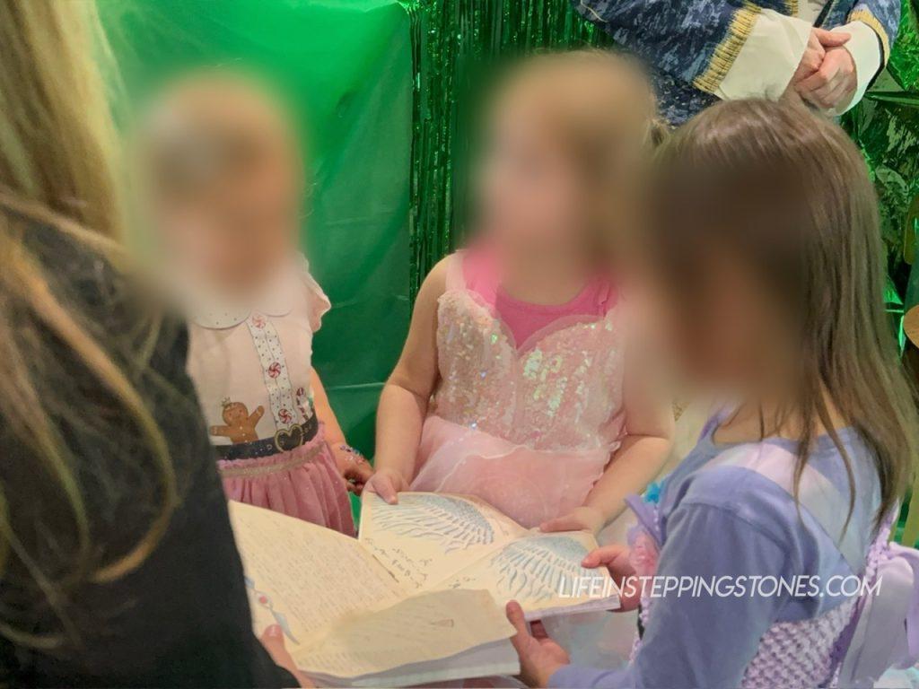 Kids read the grimmerie from Wicked for birthday party game